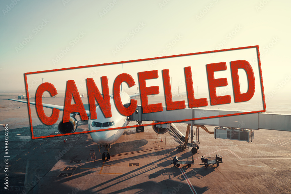 Obraz premium Flights cancelled. Jet aircraft docked in airport. Parking at terminal gate.