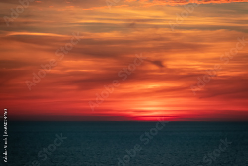 Panoramic sunset view from Sveti Stefan at Adriatic Mediterranean Sea  Budva Riviera  Montenegro  Europe. Reflection of sun beams on water surface during twilight. Summer vacation in seaside resort