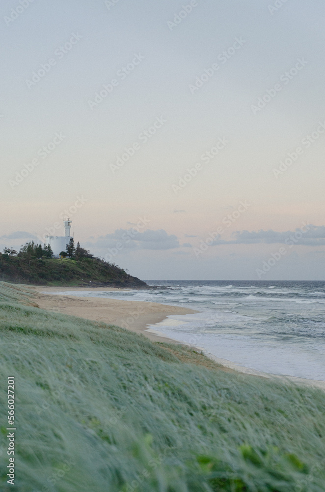 Sunset at the dog beach with the lighthouse of Point Cartwright Mooloolaba Kawana Queensland Australia