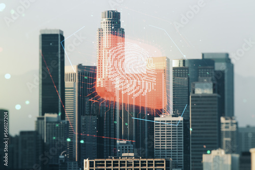 Multi exposure of virtual fingerprint scan interface on Los Angeles office buildings background, digital access concept