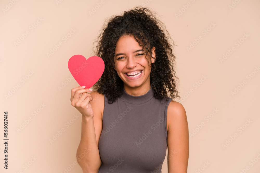 Young african american woman holding a heart for valentines day isolated Young african american woman holding a heart for valentines day isolated