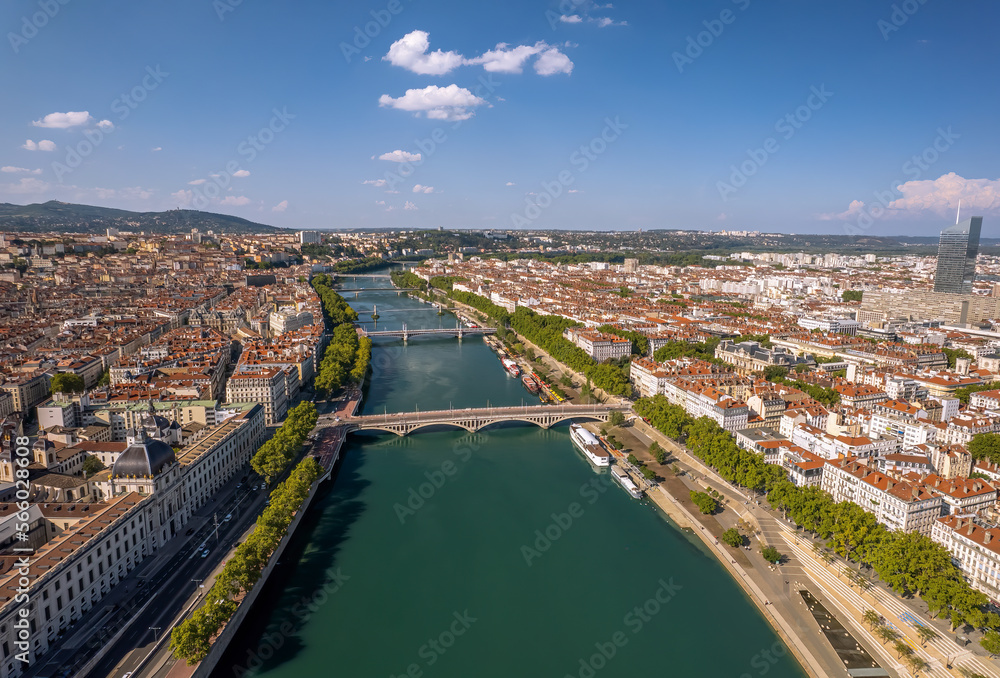 The drone aerial view of Rhone River runs through the downtown district of Lyon, France.