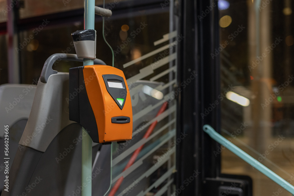 Orange ticket validator as used in public transport in the city of Prague on a city tram.