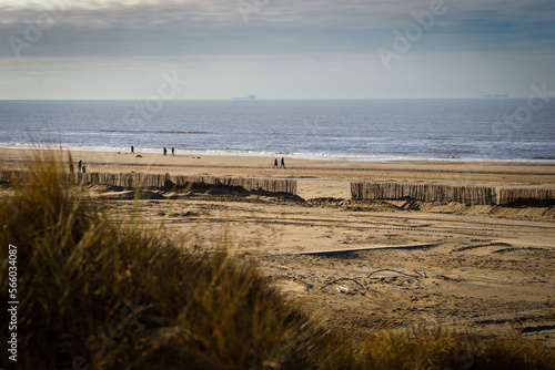 People enjoy sunny winter day on the Katwijk beach  photo