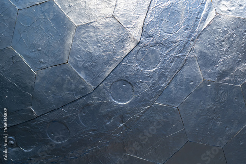 Modern background with metal hexagons and circles covered with scratches and roughness
