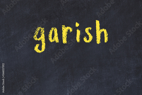 Obraz na plátně Black chalkboard with inscription garish on in