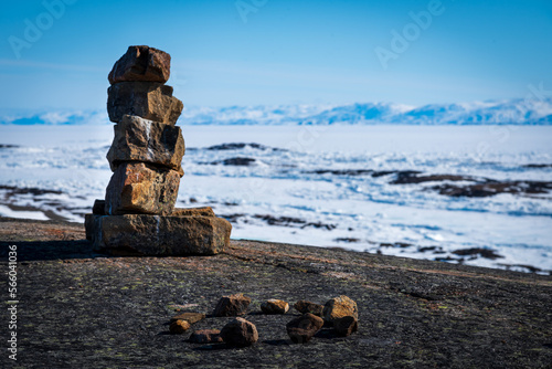 Inukshuk overlooking arctic landscape, Nunavut, Canada.