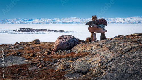 Inukshuk overlooking arctic landscape, Nunavut, Canada. photo