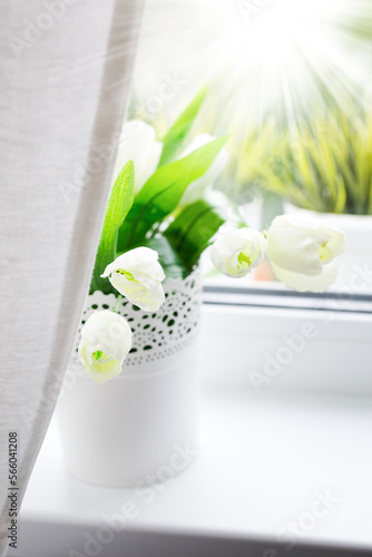 Bouquet of tulips on windowsill