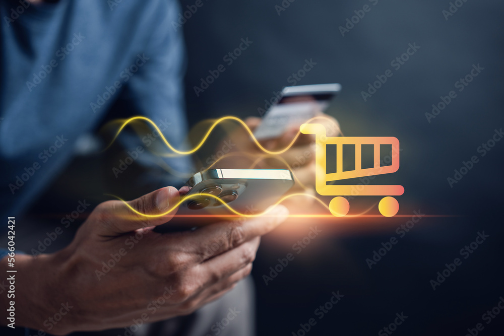Shopping online payment concept. Man hand using smart phone with cart delivery icon, banking and online shopping via banking mobile app, E-transaction and financial technology. Shopping online payment concept. Man hand using smart phone with cart delivery icon, banking and online shopping via banking mobile app, E-transaction and financial technology.