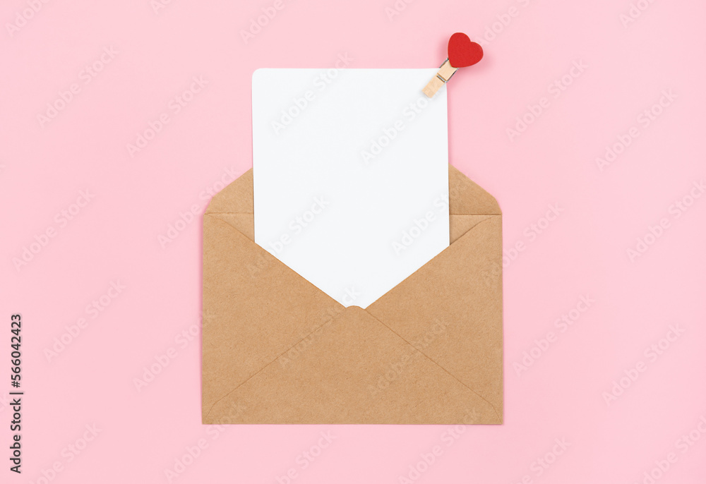 Open envelope with blank greeting card on pink background, copy space Open envelope with blank greeting card on pink background, copy space