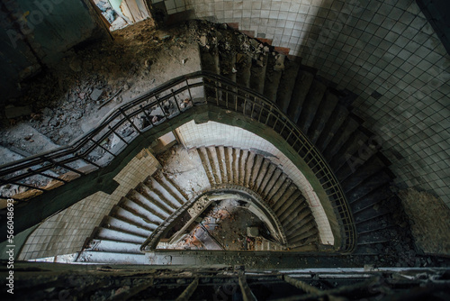 Old spiral staircase at the old abandoned building, top view