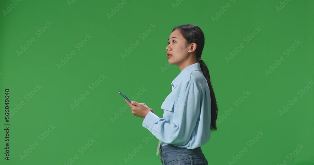 Side View Of Asian Business Woman Using Mobile Phone An Looking Around On Green Screen Background In The Studio
Side View Of Asian Business Woman Using Mobile Phone An Looking Around On Green Screen Background In The Studio