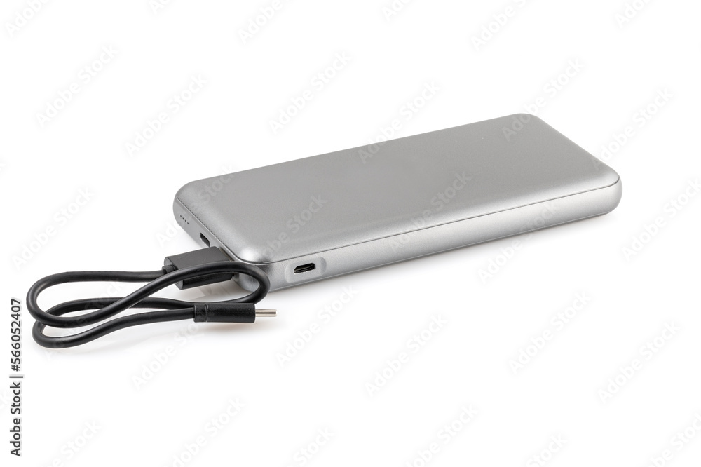 Additional autonomous power bank for charging mobile devices. External battery isolated on white background. Silver charger for a smartphone with a power supply (battery). Full depth of field. Additional autonomous power bank for charging mobile devices. External battery isolated on white background. Silver charger for a smartphone with a power supply (battery). Full depth of field.