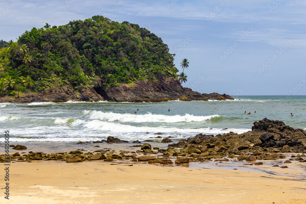 Vegetation, sand and waves at Prainha beach