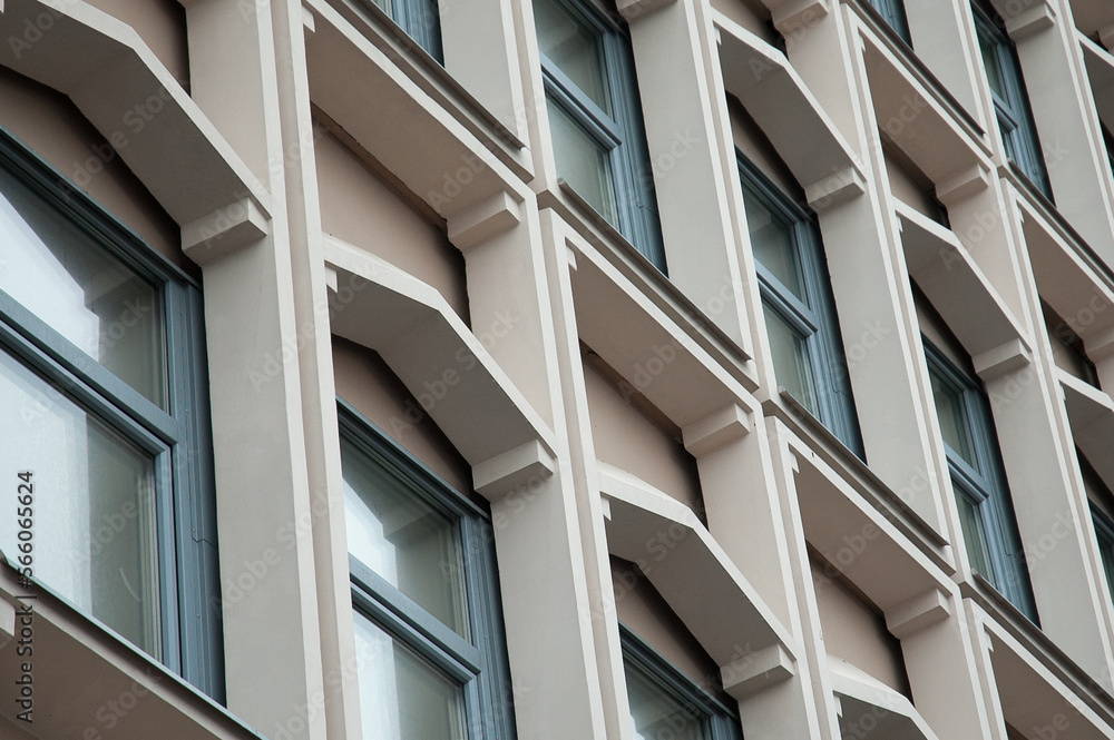 windows of a high-rise building close-up view from below windows of a high-rise building close-up view from below