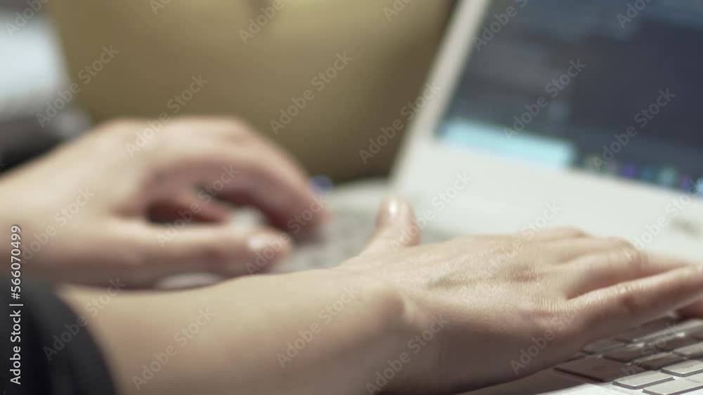 Web developer at work. Woman's hands typing and coding software on the laptop
