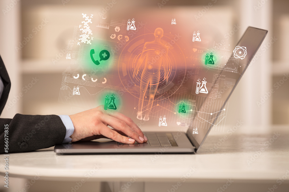 Doctor working on laptop with healthcare concept Doctor working on laptop with healthcare concept