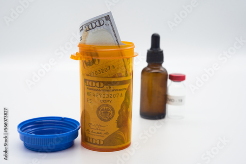 Covid vaccine vial booster shot flu sickness cost money currency