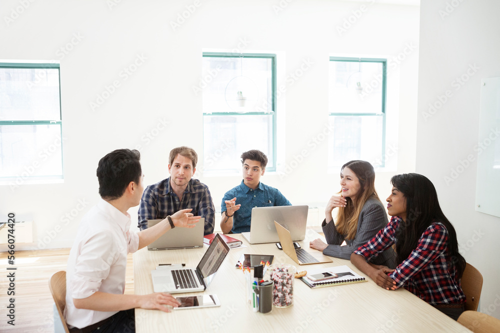 Business people discussing in board room at creative office Business people discussing in board room at creative office