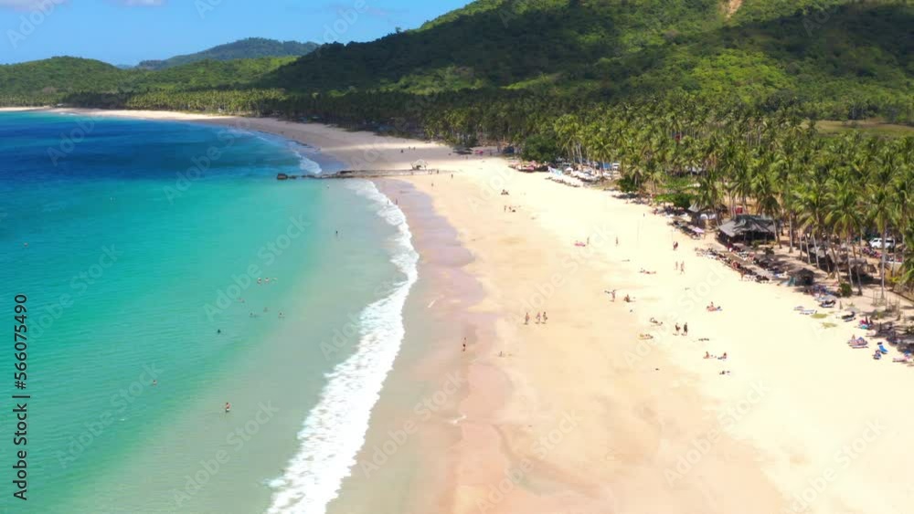 Aerial view from the top of tropical beach in El Nido, Philippines. Travelers enjoying vacation here Aerial view from the top of tropical beach in El Nido, Philippines. Travelers enjoying vacation here