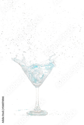 Blue Cocktail Glass with splashing water alcohol  Crystal Cocktail drink splatter splash in air and bubble from glass. Liquor Part freeze shot high speed over black background isolated