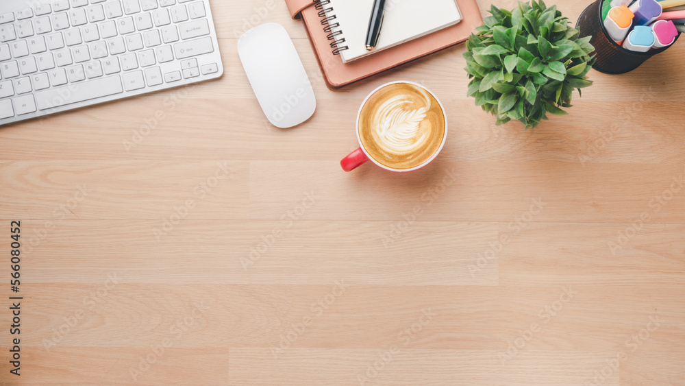Office wooden desk workplace with keyboard, mouse, notebook, pen and cup of coffee, Top view flat lay with copy space. Office wooden desk workplace with keyboard, mouse, notebook, pen and cup of coffee, Top view flat lay with copy space.