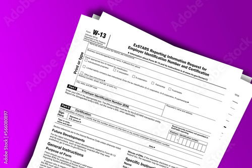 Form W-13 documentation published IRS USA 01.24.2014. American tax document on colored © dmitriy