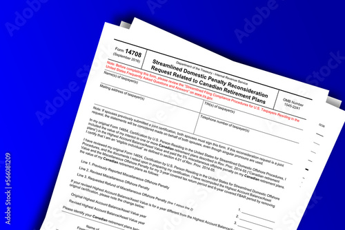 Form 14708 documentation published IRS USA 10.13.2016. American tax document on colored photo