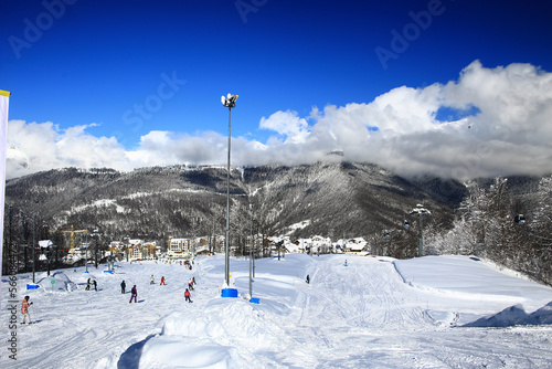 ski slope a lot of skiers background blurred © kichigin19