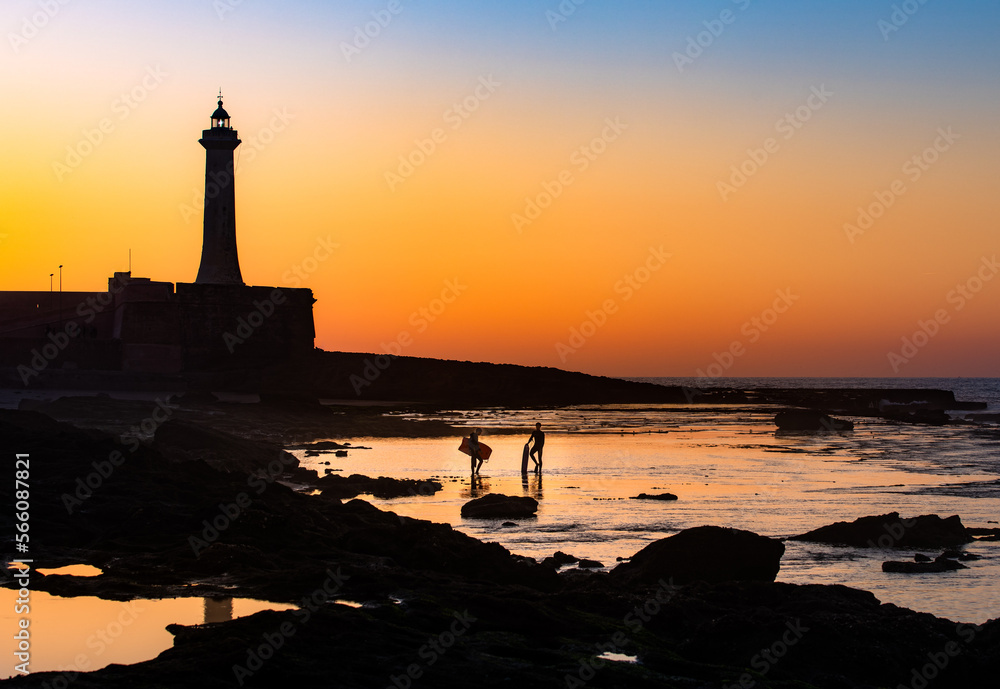Sunset with the lighthouse of Plage de Rabat