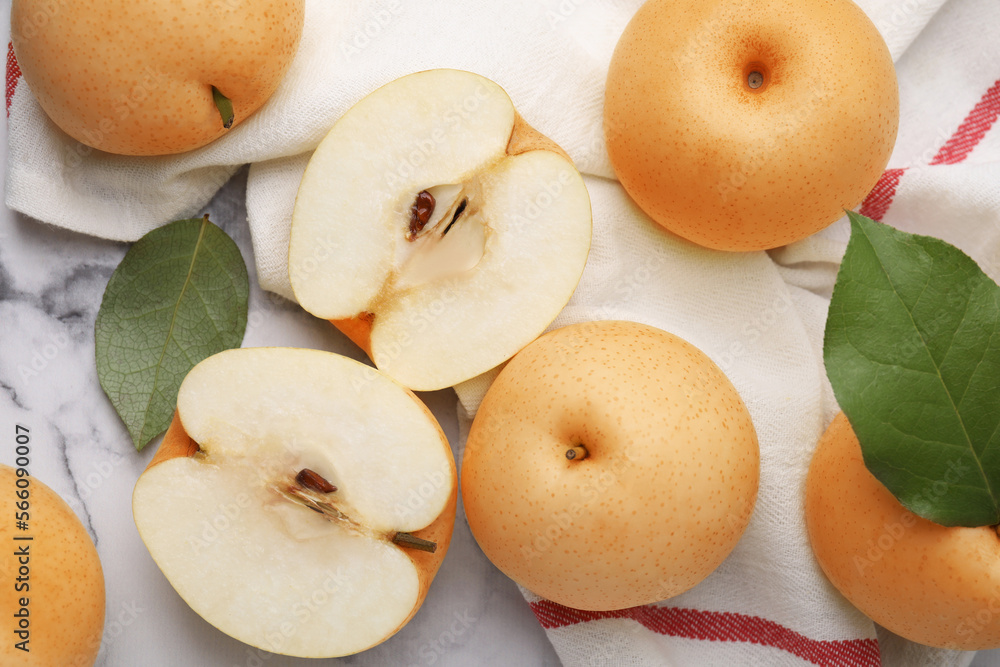 Delicious apple pears on white marble table, flat lay Delicious apple pears on white marble table, flat lay