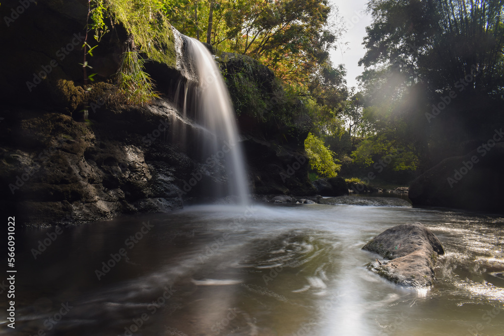Tropical landscape. Beautiful hidden waterfall in rainforest. Slow shutter speed Tropical landscape. Beautiful hidden waterfall in rainforest. Slow shutter speed