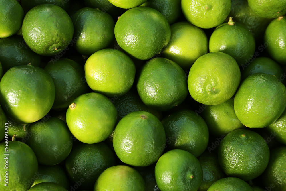 Fresh ripe green limes as background, top view Fresh ripe green limes as background, top view