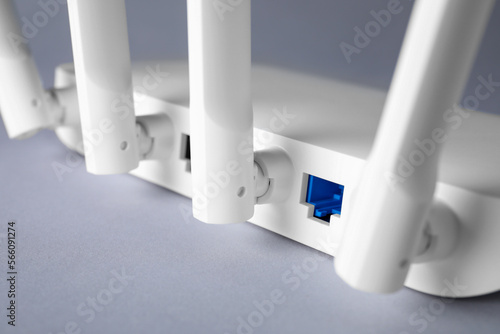 Wi-Fi router on light grey background, closeup