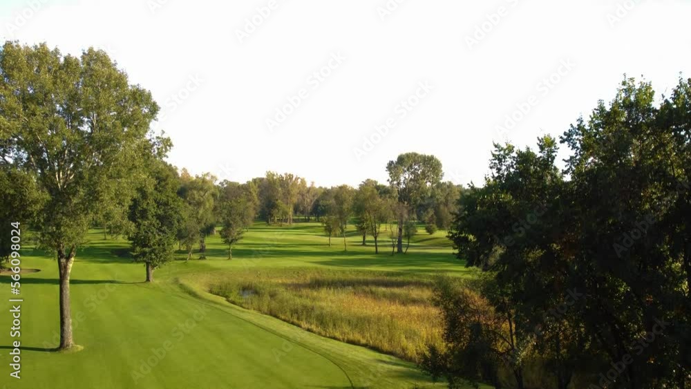 Establishing Rising Aerial View Of Empty Golf Course during sunny weather day. Establishing Rising Aerial View Of Empty Golf Course during sunny weather day.