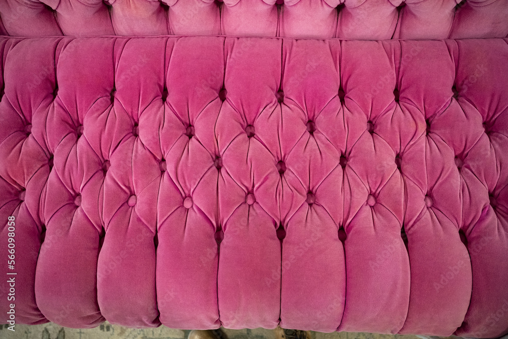 Fototapeta premium bright pink velvet sofa texture with button tufts