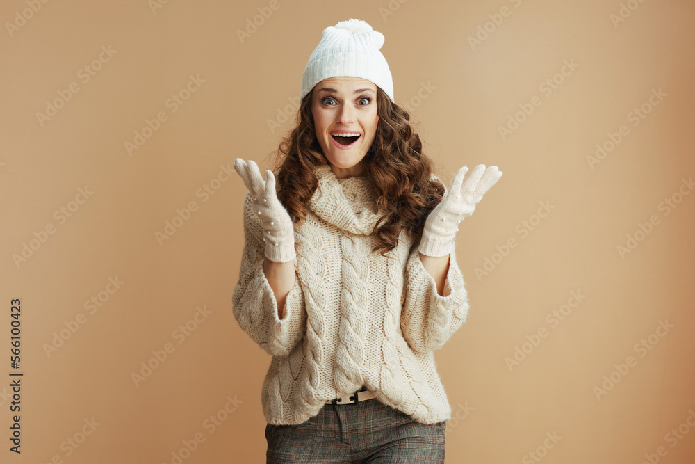 surprised stylish 40 years old woman isolated on beige surprised stylish 40 years old woman isolated on beige