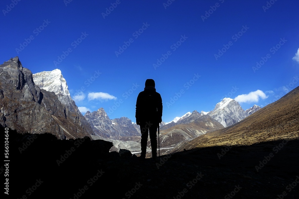 A trekker watching over the Khumbu Valley, Nepalese Himalayas. Never stop exploring. 