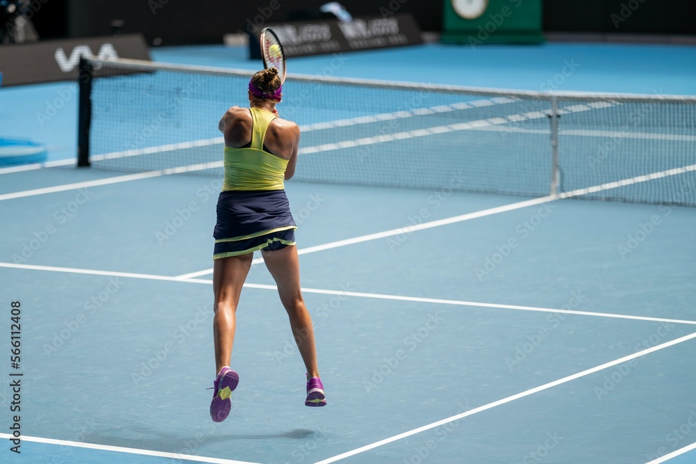 female Professional athlete Tennis player playing on a court in a tennis tournament in summer