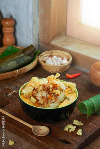 Indonesian traditional food, namely ketoprak and lontong sayur for breakfast with the darkmood photo concept photo