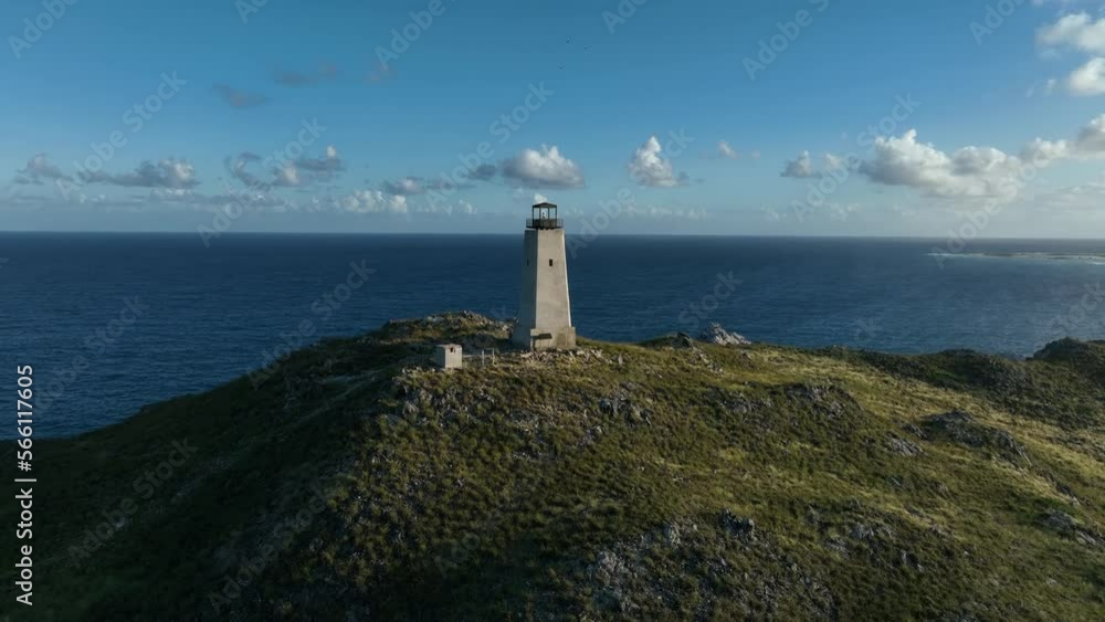 Aerial drone view around the lighthouse on top of the hill. Gran Roque Island in Los Roques Archipelago. Venezuela. Aerial drone view around the lighthouse on top of the hill. Gran Roque Island in Los Roques Archipelago. Venezuela.