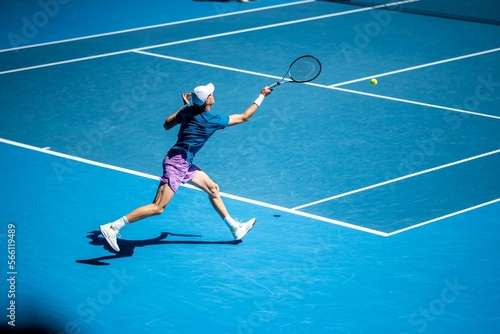 Professional athlete Tennis player playing on a court in a tennis tournament in summer © William