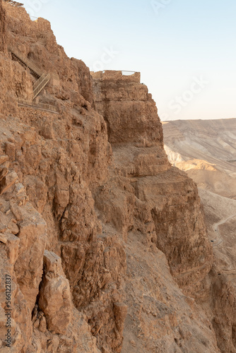 The remains  of outer walls in the rays of the rising sun in the ruins of the fortress of Masada - is a fortress built by Herod the Great on a cliff-top off the coast of the Dead Sea  Israel