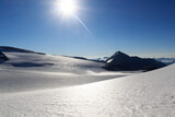 Mountain snow and glacier Pasterze panorama with sun in Glockner Group, Austria