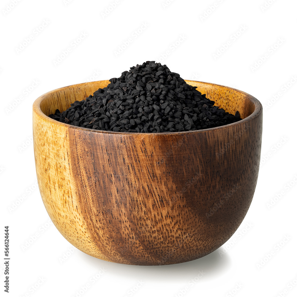 black cumin seeds in wooden bowl isolated on white black cumin seeds in wooden bowl isolated on white
