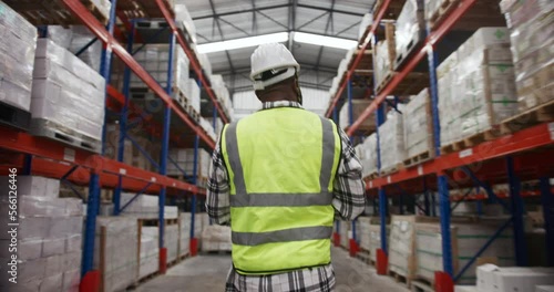 Walking to check stock in warehouse