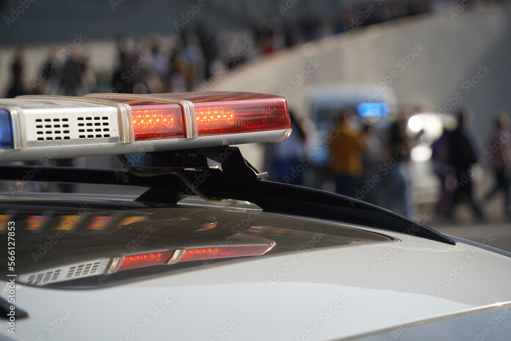 Obraz premium Almaty, Kazakhstan - 09.16.2022 : A Kazakh police car with flashing beacons is on patrol in a public place.
