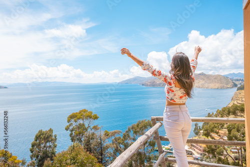 happy latin woman enjoying summer on the sun island on the shores of lake titica