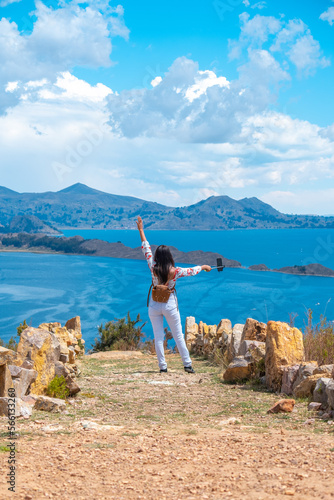 Принти на полотні horizontal photo of a young latin brunette woman taking selfie on vacation on th